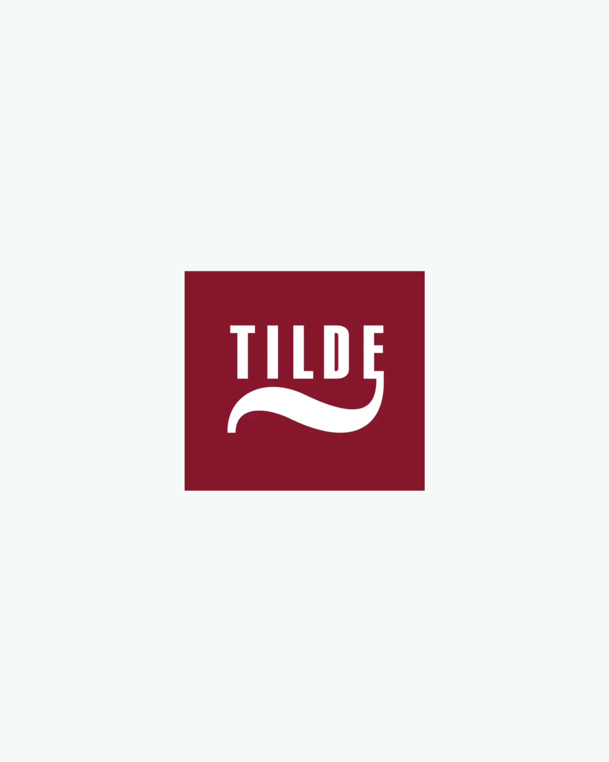 Tilde logo on a light background